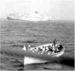 One of the lifeboats carrying officers arrives at the Allen. Photo: Werner O. Grabner