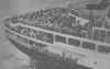 Survivors crowd the fantail as the Ile de France docks