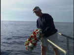 Crewmember dropping the wreath. Photo: Courtesy Dan Crowell