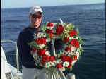 Crewmember holding the wreath. Photo: Courtesy of Dan Crowell