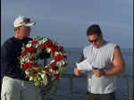 Crewman holding the wreath, William Cleary reading the memorial. Photo: Courtesy Dan Crowell