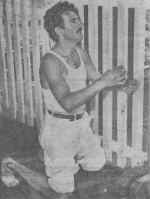 Gaetano Minotauro, a cook on the Andrea Doria, kneels down in prayer. Photo: Pat Candido