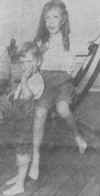 Silent and barefoot, Rosmarie Wells, left, and Marilyn Graf, right, rest aboard the Ile de France. Photo: UP