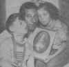 The Pacchiano's holding the picture of the Sacred Heart, to Whom they had prayed for survival. Photo: Journal American